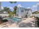 This backyard features a bright blue house, stairs, and a refreshing pool at 2519 1St N Ave, St Petersburg, FL 33713