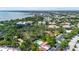 Aerial view showcases the community, landscaping, water views, and pool at 2630 Pearce Dr # 108, Clearwater, FL 33764