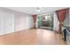 Spacious bedroom with laminate floors, dual closets and sliding glass door to patio at 2630 Pearce Dr # 108, Clearwater, FL 33764