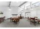Bright common room featuring light walls, high ceilings, and tables with seating for residents at 2630 Pearce Dr # 108, Clearwater, FL 33764
