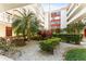 Garden area with verdant greenery, trees, rocks and manicured hedges at 2630 Pearce Dr # 108, Clearwater, FL 33764