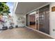 Cozy patio area with sliding glass doors leading to an interior room and storage space at 2630 Pearce Dr # 108, Clearwater, FL 33764