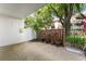 Inviting patio area with brick accents, planters, and view of the complex at 2630 Pearce Dr # 108, Clearwater, FL 33764