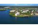 Scenic aerial view of the waterfront condo building surrounded by lush landscaping at 2700 Bayshore Blvd # 11308, Dunedin, FL 34698