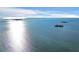 Scenic aerial view featuring calm waters and distant islands under a bright, partly cloudy sky at 2700 Bayshore Blvd # 11308, Dunedin, FL 34698
