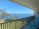 Enjoy the stunning waterfront views from this condo's private balcony with black railings and Adirondack chairs at 2700 Bayshore Blvd # 11308, Dunedin, FL 34698