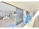 Scenic balcony with comfortable chairs, offering stunning views and seamless indoor-outdoor living at 2700 Bayshore Blvd # 11308, Dunedin, FL 34698