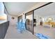 Spacious condo balcony featuring Adirondack chairs and direct access to the living area with open floorplan at 2700 Bayshore Blvd # 11308, Dunedin, FL 34698