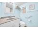 Bathroom with light blue walls, granite counters, and neutral fixtures at 2700 Bayshore Blvd # 11308, Dunedin, FL 34698