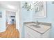 Bathroom sink and countertop with a view of the hallway and living room at 2700 Bayshore Blvd # 11308, Dunedin, FL 34698