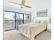 Relax in this waterfront bedroom featuring an ensuite balcony with views of the bay at 2700 Bayshore Blvd # 11308, Dunedin, FL 34698