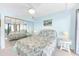 Bedroom features a large closet, coastal theme, and balcony access with a water view at 2700 Bayshore Blvd # 11308, Dunedin, FL 34698