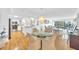 Inviting dining area featuring a glass table, wicker chairs, and a stylish chandelier overlooking the river at 2700 Bayshore Blvd # 11308, Dunedin, FL 34698