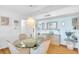 Inviting dining area featuring a round glass table, seating for four, and a stylish chandelier at 2700 Bayshore Blvd # 11308, Dunedin, FL 34698