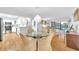 Bright dining area and kitchen with stainless steel appliances and cozy seating near the window views at 2700 Bayshore Blvd # 11308, Dunedin, FL 34698