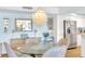 Charming dining area featuring a chandelier, stylish furnishings, and easy access to the kitchen at 2700 Bayshore Blvd # 11308, Dunedin, FL 34698