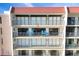 This condo features multiple floors and balconies with cozy seating, including Adirondack chairs at 2700 Bayshore Blvd # 11308, Dunedin, FL 34698