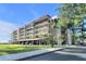 Stunning condominium showcasing multiple balconies, covered parking, and meticulously maintained landscaping at 2700 Bayshore Blvd # 11308, Dunedin, FL 34698