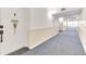 Hallway leading to unit 208 with decoration at 2700 Bayshore Blvd # 11308, Dunedin, FL 34698