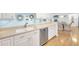 Bright kitchen with white cabinets, modern stainless steel dishwasher, and stylish backsplash at 2700 Bayshore Blvd # 11308, Dunedin, FL 34698