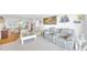 Inviting living room features plush seating, bright lighting, and a nautical-themed decor at 2700 Bayshore Blvd # 11308, Dunedin, FL 34698