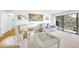 Inviting living room with plush seating, bright lighting, and sliding glass doors to the balcony at 2700 Bayshore Blvd # 11308, Dunedin, FL 34698