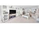 Spacious living area with a plush sofa, decorative accents, and seamlessly flows into the dining area at 2700 Bayshore Blvd # 11308, Dunedin, FL 34698