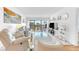 Bright, open living room featuring water views from the balcony, with comfortable and stylish seating at 2700 Bayshore Blvd # 11308, Dunedin, FL 34698