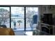 Enjoy scenic waterfront views from the living room, featuring access to the balcony through sliding glass doors at 2700 Bayshore Blvd # 11308, Dunedin, FL 34698