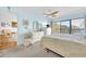 Relaxing main bedroom with water views, a ceiling fan, and stylish furnishings at 2700 Bayshore Blvd # 11308, Dunedin, FL 34698