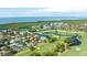 Panoramic aerial showcases this homes location near golf course and the bay at 2900 Sandpiper Pl, Clearwater, FL 33762
