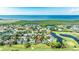 Aerial view showcases the property's location near golf course, bay and green areas at 2900 Sandpiper Pl, Clearwater, FL 33762