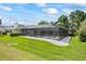 Spacious, meticulously maintained backyard with an enclosed patio at 2900 Sandpiper Pl, Clearwater, FL 33762