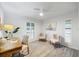 Inviting bedroom featuring neutral tones, plush seating, and a tranquil sailboat painting at 2900 Sandpiper Pl, Clearwater, FL 33762