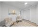Bright bedroom with a coastal-themed artwork, and ample closet space at 2900 Sandpiper Pl, Clearwater, FL 33762