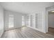 Well-lit, versatile room with built-in bookshelves, offering both style and functionality at 2900 Sandpiper Pl, Clearwater, FL 33762