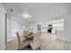 Inviting dining area with wicker chairs, a table set for four, and easy access to the kitchen at 2900 Sandpiper Pl, Clearwater, FL 33762