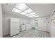 Well-lit laundry room with modern appliances, ample space, and stylish flooring at 2900 Sandpiper Pl, Clearwater, FL 33762