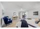 Bright main bedroom with patio access, en-suite bath, ceiling fan, and a dresser at 2900 Sandpiper Pl, Clearwater, FL 33762