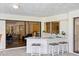 Stylish outdoor bar with seating, sleek countertops, and easy access to the indoor and outdoor spaces at 2900 Sandpiper Pl, Clearwater, FL 33762