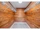 Large walk-in closet with cedar-lined walls and wire shelving for storage at 2900 Sandpiper Pl, Clearwater, FL 33762