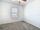 Bedroom with carpet and a window at 31771 Blue Passing Loop, Wesley Chapel, FL 33545