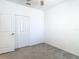 Bright bedroom featuring neutral carpeting and a closet with bi-fold doors at 31771 Blue Passing Loop, Wesley Chapel, FL 33545