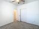 Bedroom featuring gray carpet, ceiling fan, and natural light at 31771 Blue Passing Loop, Wesley Chapel, FL 33545