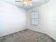 Simple bedroom with fan and neutral carpet at 31771 Blue Passing Loop, Wesley Chapel, FL 33545