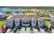 Charming exterior of townhomes with blue shutters and well-kept landscaping at 31771 Blue Passing Loop, Wesley Chapel, FL 33545