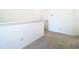 Upstairs hallway features carpet and white walls at 31771 Blue Passing Loop, Wesley Chapel, FL 33545