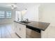 Kitchen island featuring stainless steel dishwasher and granite countertop at 31771 Blue Passing Loop, Wesley Chapel, FL 33545