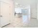 Spacious kitchen boasting tile flooring, center island and open floor plan at 31771 Blue Passing Loop, Wesley Chapel, FL 33545