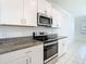 Well-equipped kitchen with stainless steel appliances and modern countertops at 31771 Blue Passing Loop, Wesley Chapel, FL 33545